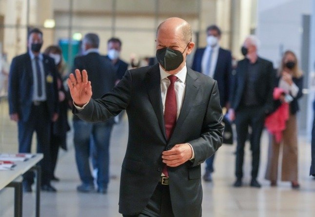 SPD chancellor candidate Olaf Scholz walks in the Bundestag after the German election.